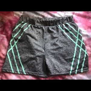 Gray spandex with turquoise stripes.